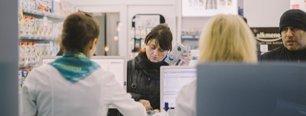 Woman at pharmacy counter