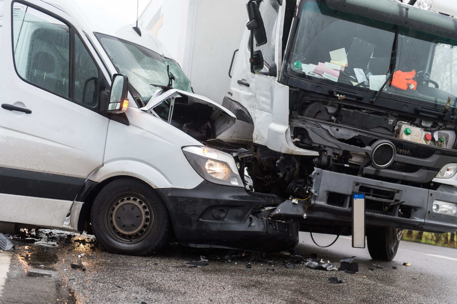 A serious truck accident involving a white van and a large commercial truck with extensive front-end damage, highlighting the dangers of truck collisions in Cape Coral, Florida.