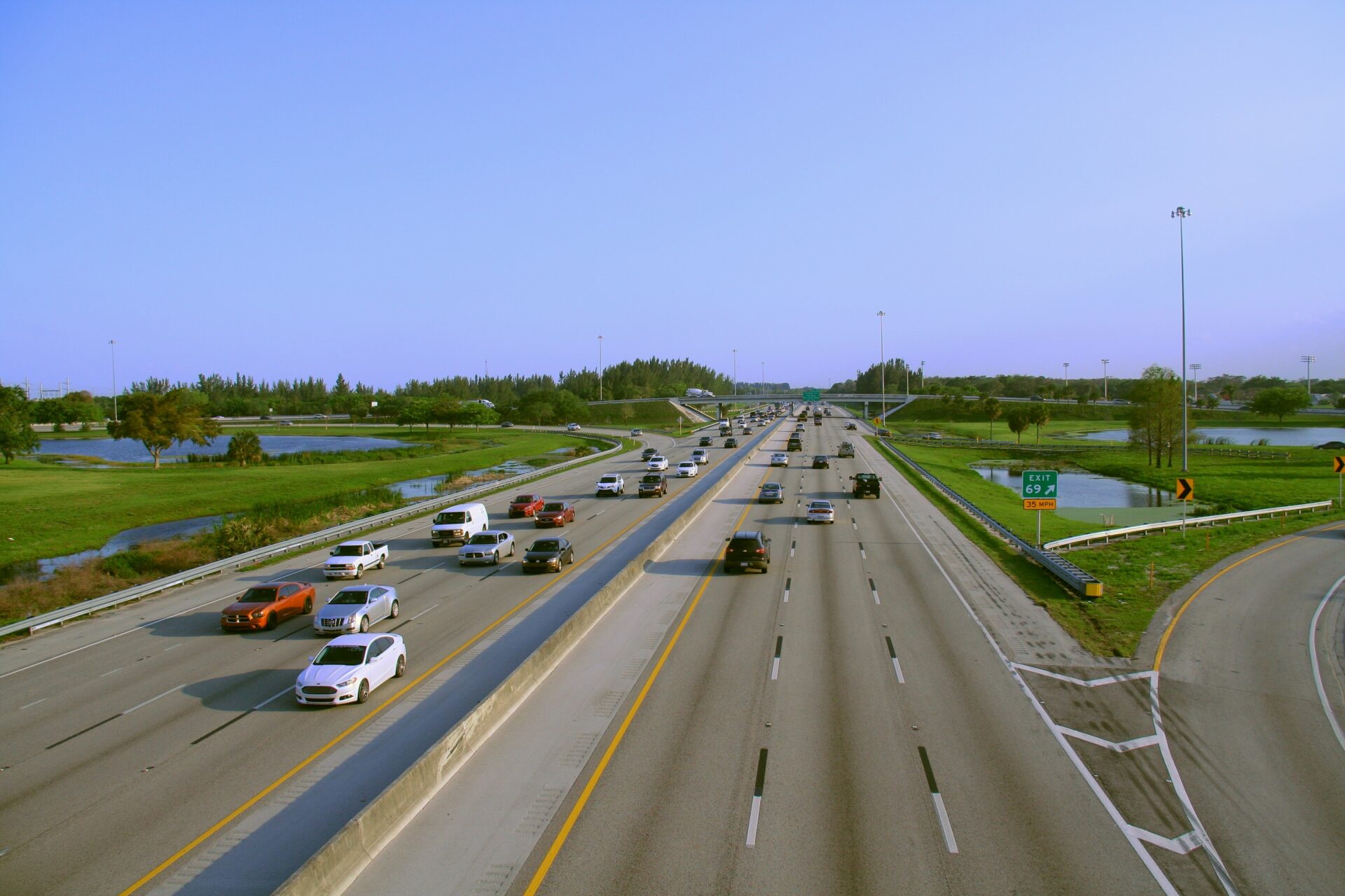 Overhead view of a busy multi-lane highway in Pompano Beach, Florida, illustrating the heavy traffic and potential risks for truck accidents