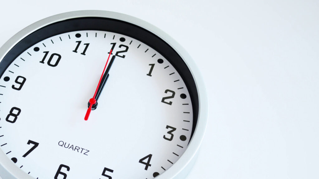 Clock at 12:00, symbolizing Uber accident settlement timelines in Florida.