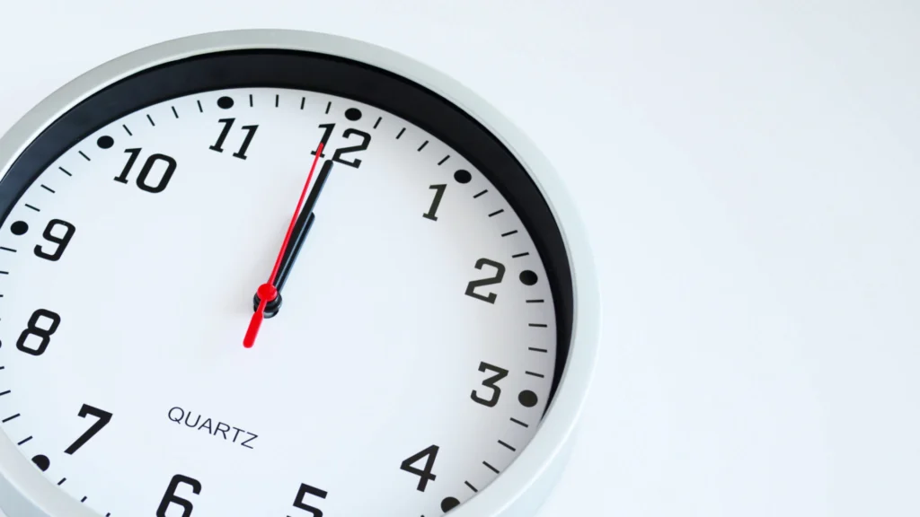 Clock at 12:00, symbolizing Uber accident settlement timelines in Florida.