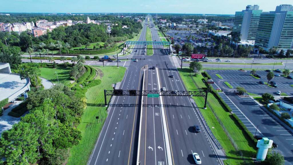 Aerial view of Boca Raton highway with traffic and palm trees, linked to Uber accidents