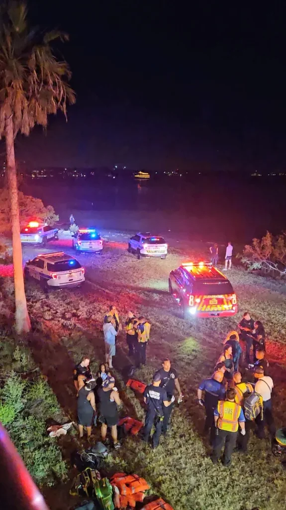 Police and emergency responders at night by water after Clearwater Ferry crash
