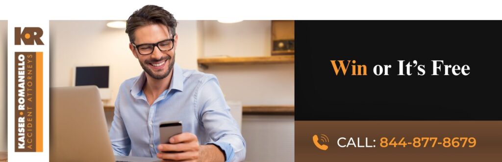 Advertisement featuring a smiling man using a smartphone and laptop, alongside text promoting legal services from Kaiser Romanello Attorneys with a "Win or It's Free" offer and a phone number.