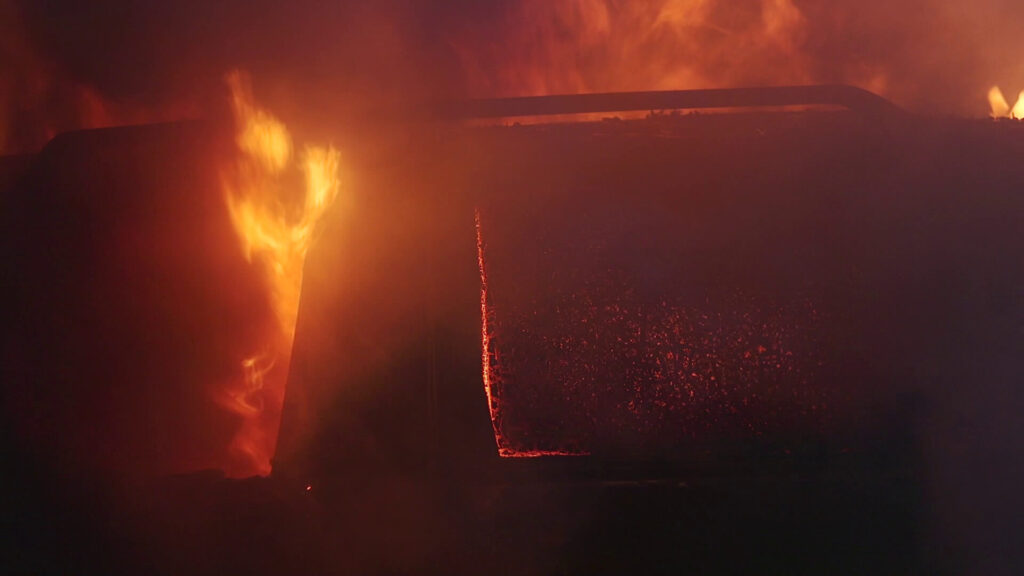 Fiery crash between a Hyundai Tucson and semitruck on State Road 60, Osceola County, showing intense flames and smoke.