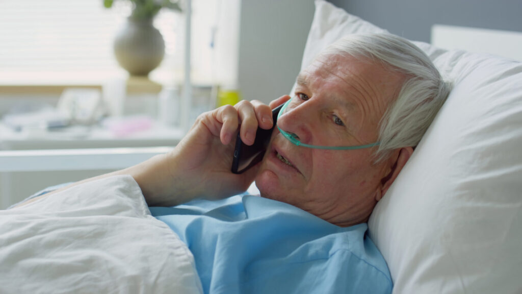 Elderly person in hospital bed calling after slip and fall injury in Florida