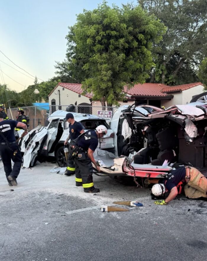 Firefighters respond to a severe multi-car rollover crash in northwest Miami-Dade, using rescue tools to extract victims from mangled vehicles.