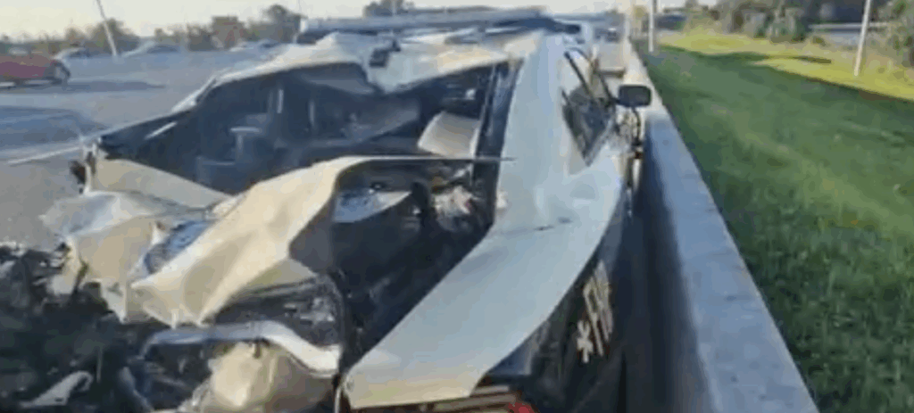 Crushed Florida Highway Patrol cruiser after a 5-car pileup on Florida’s Turnpike, highlighting the severity of the crash.