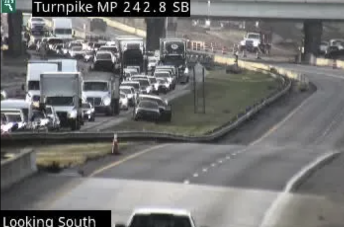 Traffic backup on Florida Turnpike southbound at mile marker 242.8 after fatal semi-truck crash near Kissimmee December 2025