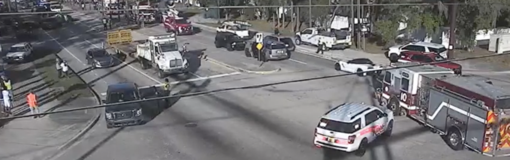 Overhead view of the 11-vehicle crash scene on Fruitville Road involving a dump truck and emergency responders in Sarasota.