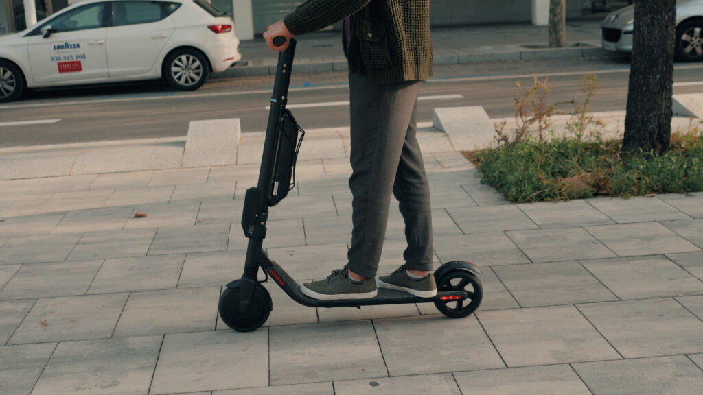 Rider on a stand-up electric scooter — Lake Nona e-scooter accident lawyer, Orange County FL