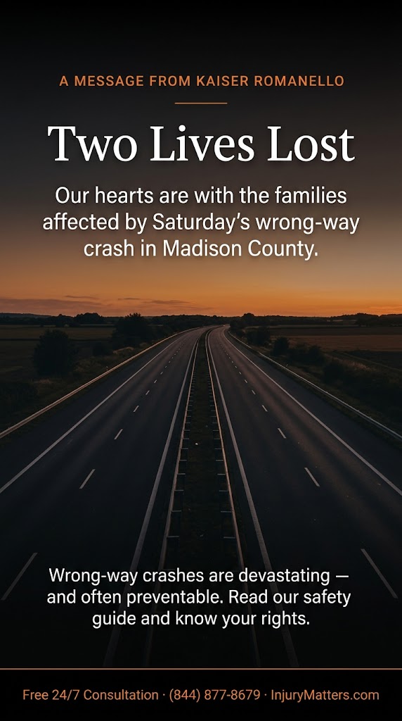 A black-and-orange vertical graphic showing an empty highway at dusk under a warm orange sunset. White and orange text reads: "A message from Kaiser Romanello — Two Lives Lost. Our hearts are with the families affected by Saturday's wrong-way crash in Madison County. Wrong-way crashes are devastating and often preventable. Read our safety guide and know your rights. Free 24/7 consultation · (844) 877-8679 · InjuryMatters.com.