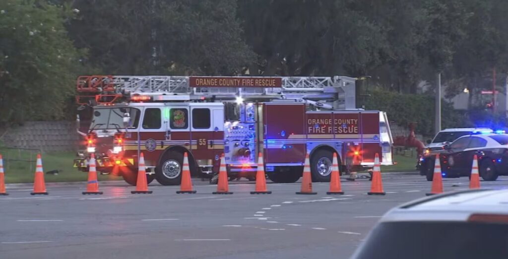 Orange County Fire Rescue truck and traffic cones at the scene of a fatal semi-truck crash on Orange Blossom Trail in Orlando